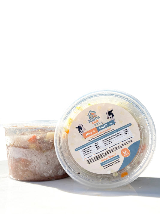 Nice to Meat You dog food and topper in front of a white background