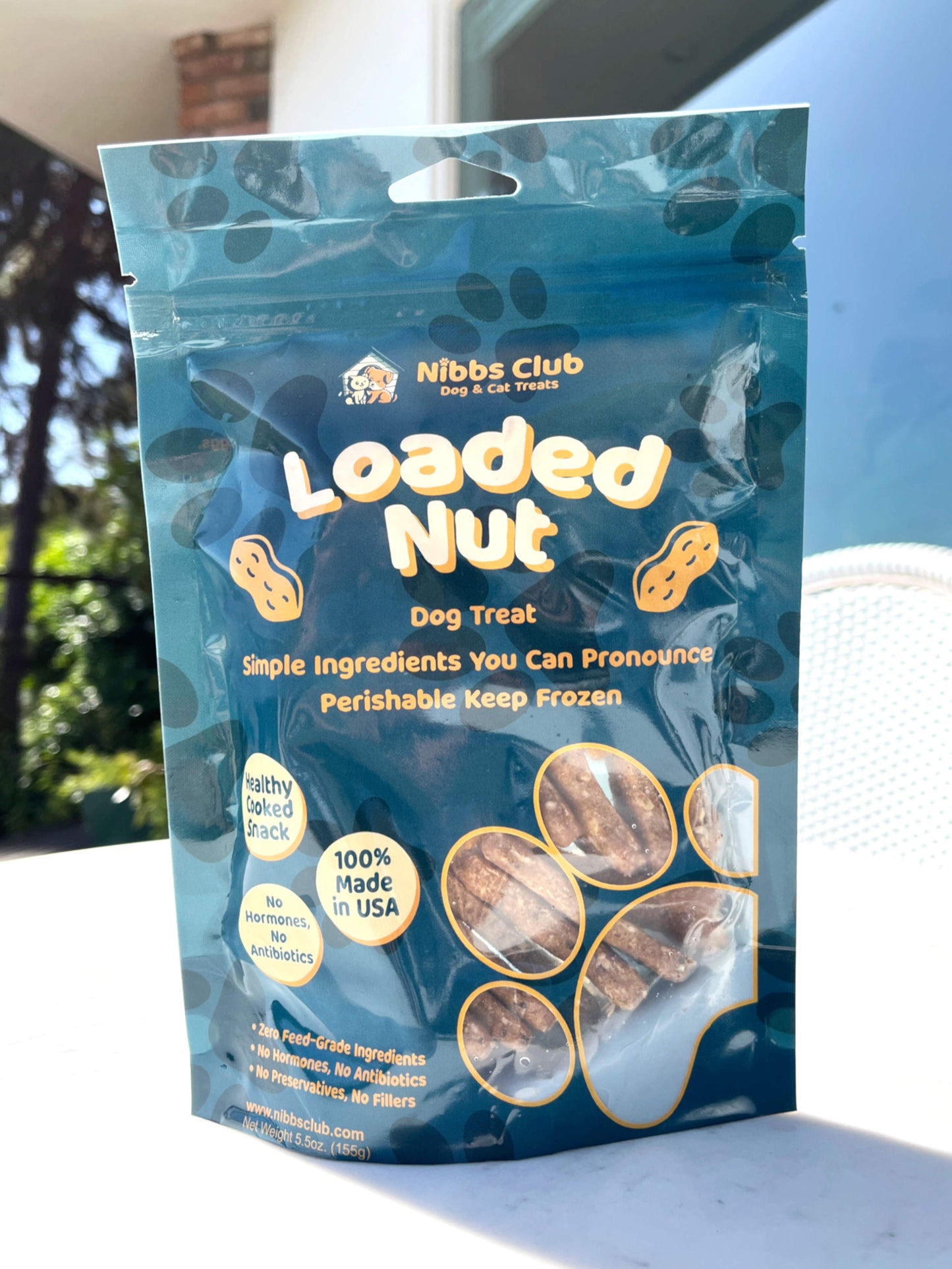 Loaded Nut dog treats pictured outside on a table